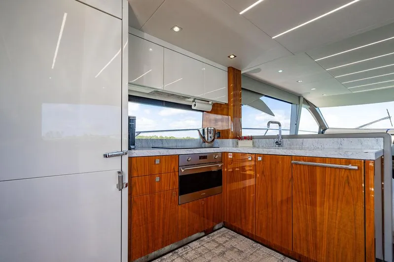 My Inspiration Yacht Photos Pics Luxurious kitchen interior of 2019 Sunseeker Manhattan 66 yacht with modern wood cabinetry.