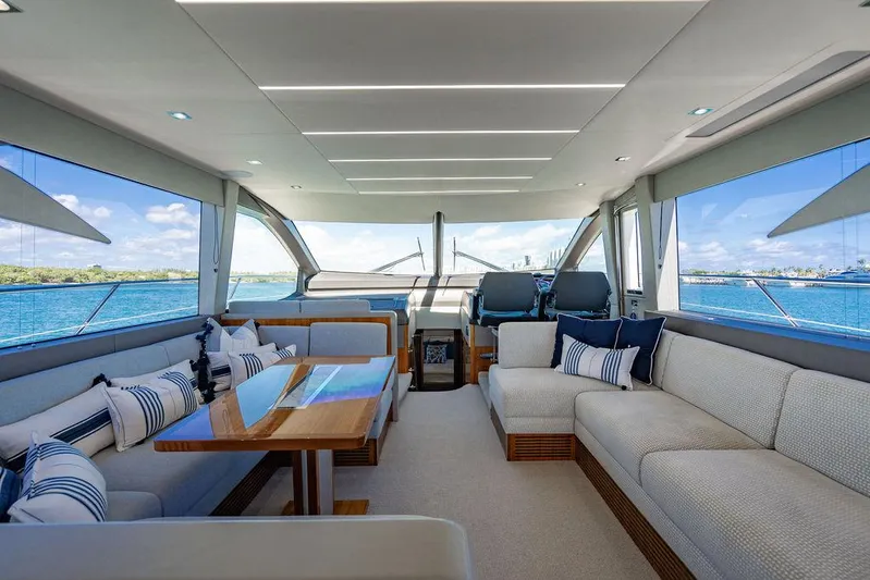 My Inspiration Yacht Photos Pics Luxurious interior of 2019 Sunseeker Manhattan 66 yacht with elegant seating and ocean view.