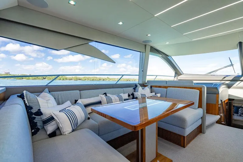 My Inspiration Yacht Photos Pics Luxurious interior of 2019 Sunseeker Manhattan 66 yacht with elegant seating and panoramic windows.