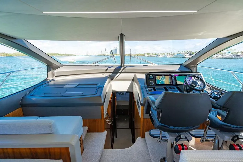 My Inspiration Yacht Photos Pics Interior view of 2019 Sunseeker Manhattan 66 yacht cockpit with modern navigation equipment.