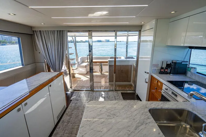 My Inspiration Yacht Photos Pics Luxurious interior of 2019 Sunseeker Manhattan 66 yacht with modern kitchen and ocean view.