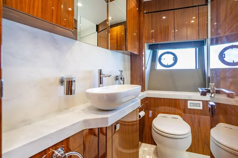 My Inspiration Yacht Photos Pics Luxurious bathroom in 2019 Sunseeker Manhattan 66 yacht with modern fixtures and wood accents.
