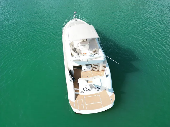 2003 Aicon Yacht 56 Yacht Photos Pics Aerial view of 2003 Aicon 56 yacht on turquoise water.