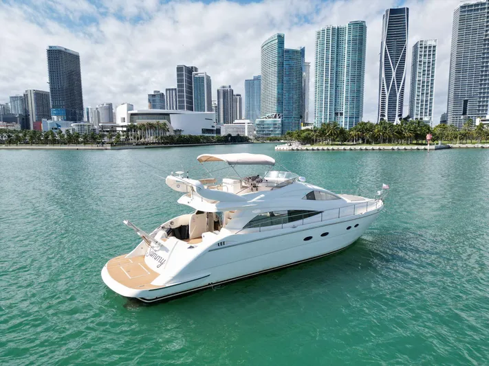 2003 Aicon Yacht 56 Yacht Photos Pics Luxury 2003 Aicon 56 yacht cruising near city skyline.