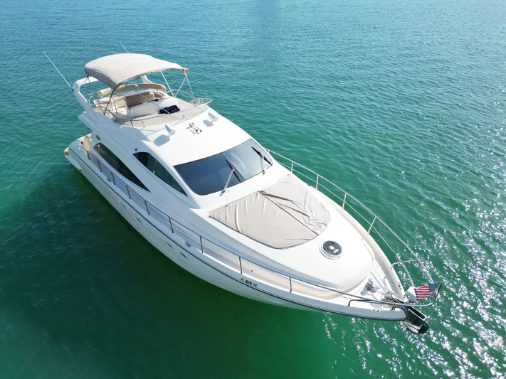 2003 Aicon Yacht 56 Yacht Photos Pics Aicon 56 yacht from 2003 on clear turquoise water, aerial view.