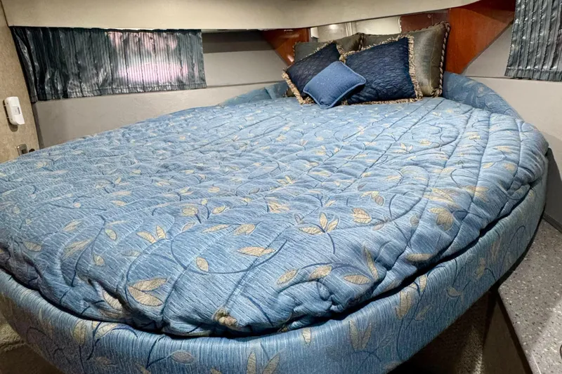 40 Formula Pc Yacht Photos Pics Luxurious 2006 Formula 40 PC cabin with a cozy, blue-patterned bed and decorative pillows.