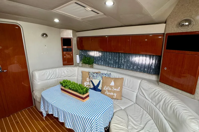 40 Formula Pc Yacht Photos Pics Luxurious 2006 Formula 40 PC yacht interior with white leather seating and nautical decor.