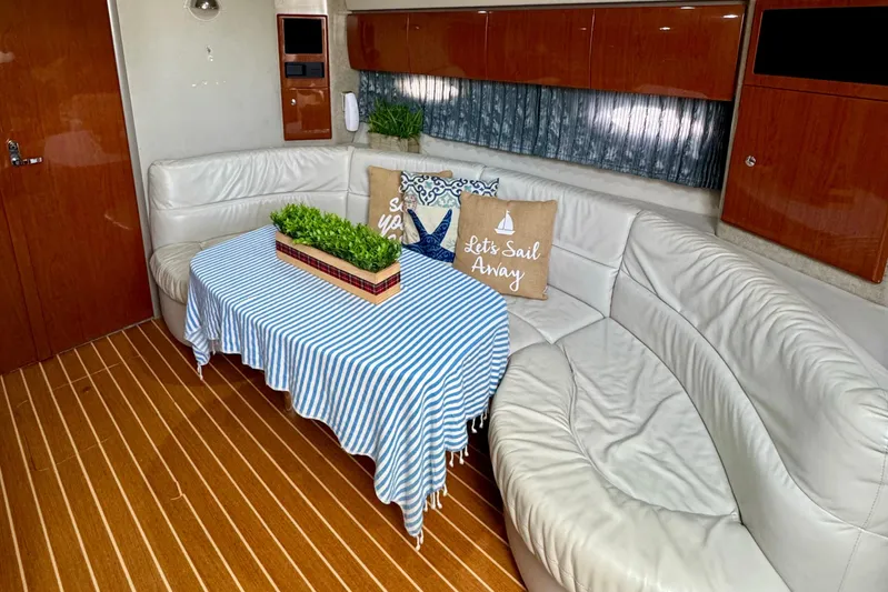 40 Formula Pc Yacht Photos Pics Interior of 2006 Formula 40 PC yacht with white leather seating and nautical decor.