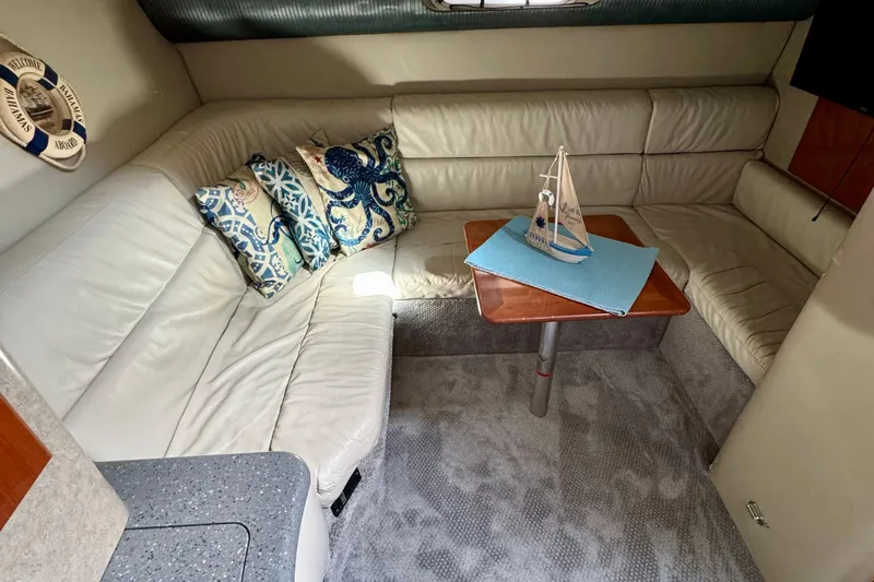 40 Formula Pc Yacht Photos Pics 2006 Formula 40 PC yacht interior with plush seating, nautical decor, and a wooden table.