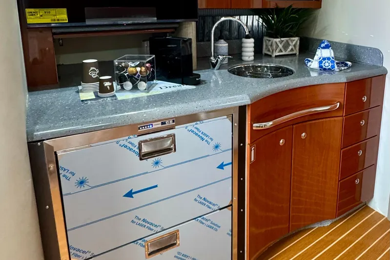 40 Formula Pc Yacht Photos Pics Luxurious 2006 Formula 40 PC yacht kitchen with modern amenities and sleek wooden cabinetry.