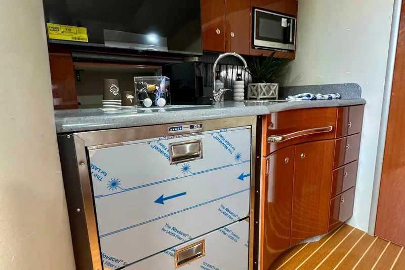 40 Formula Pc Yacht Photos Pics 2006 Formula 40 PC yacht kitchen with modern appliances and wood cabinetry.