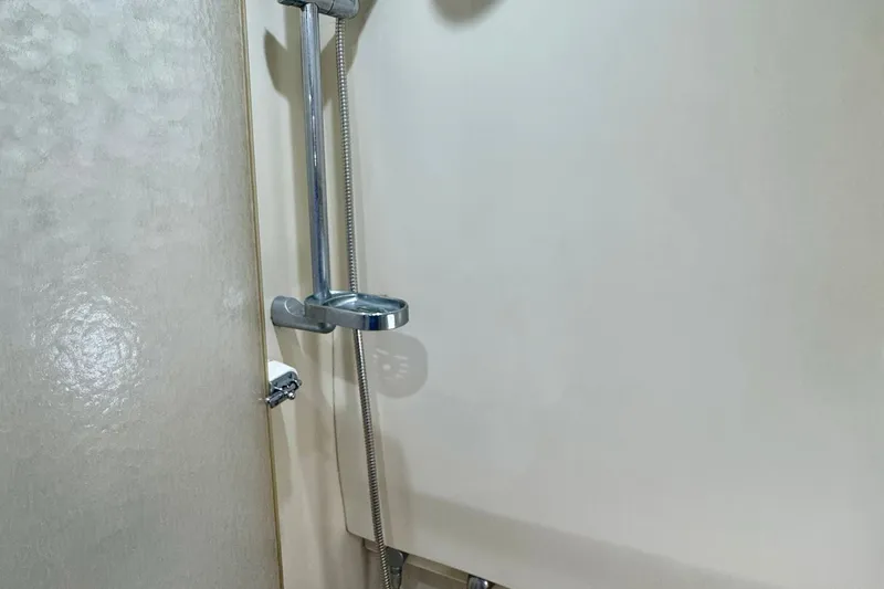 40 Formula Pc Yacht Photos Pics Shower area in 2006 Formula 40 PC boat, featuring chrome fixtures and textured walls.