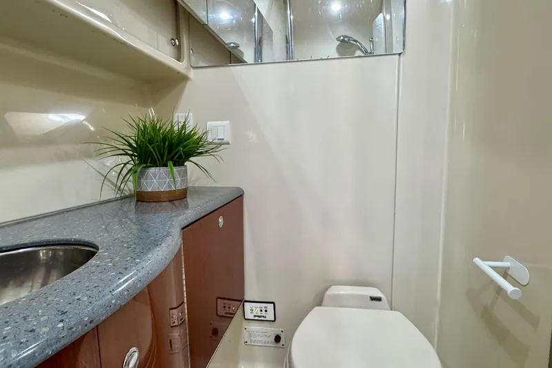 40 Formula Pc Yacht Photos Pics 2006 Formula 40 PC yacht bathroom with modern sink, toilet, and decorative plant.