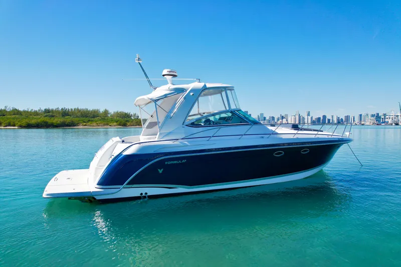 40 Formula Pc Yacht Photos Pics 2006 Formula 40 PC yacht on calm water with city skyline in background.