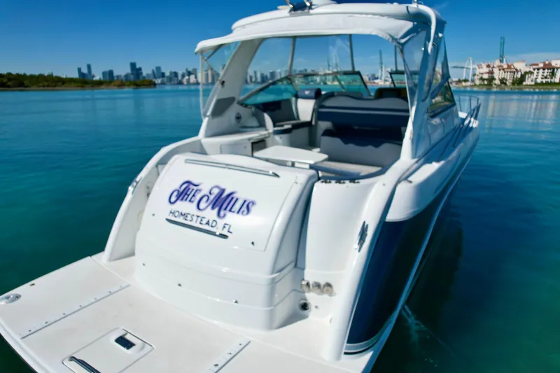 40 Formula Pc Yacht Photos Pics 2006 Formula 40 PC boat docked in clear blue water with city skyline background.