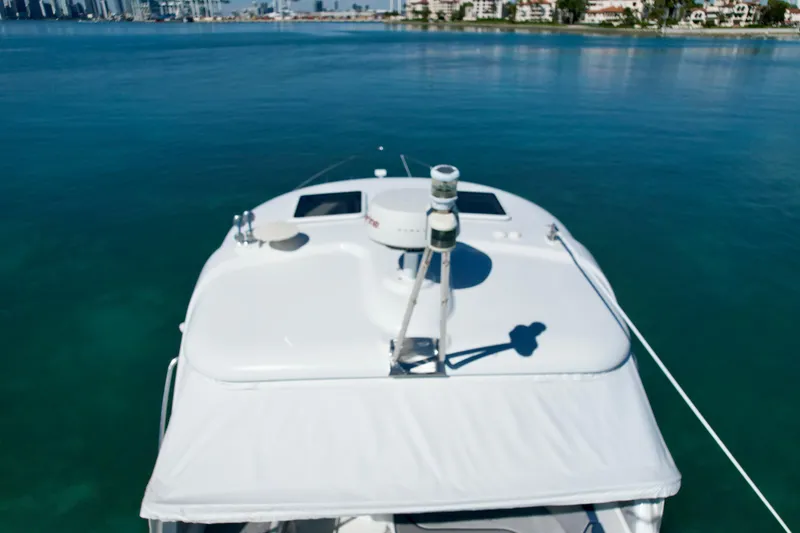 40 Formula Pc Yacht Photos Pics 2006 Formula 40 PC yacht cruising on calm blue waters near a coastal city.