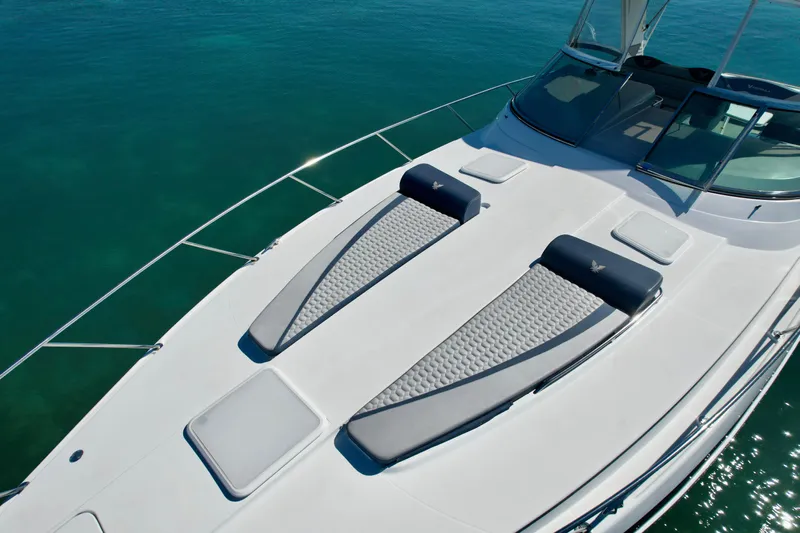 40 Formula Pc Yacht Photos Pics 2006 Formula 40 PC yacht with sun pads on deck, cruising in clear blue waters.