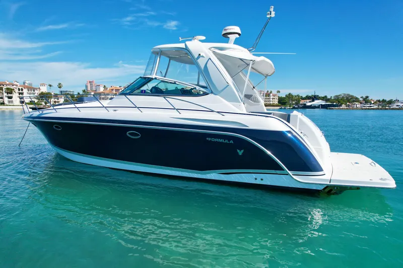 40 Formula Pc Yacht Photos Pics 2006 Formula 40 PC yacht on clear blue water, sunny day, coastal background.
