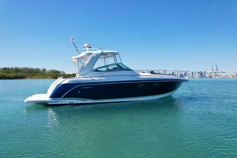 40 Formula Pc Yacht Photos Pics 2006 Formula 40 PC yacht on calm water with city skyline in background.