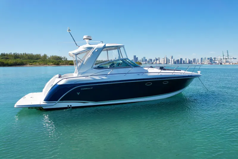 40 Formula Pc Yacht Photos Pics 2006 Formula 40 PC yacht on calm water with city skyline in background.