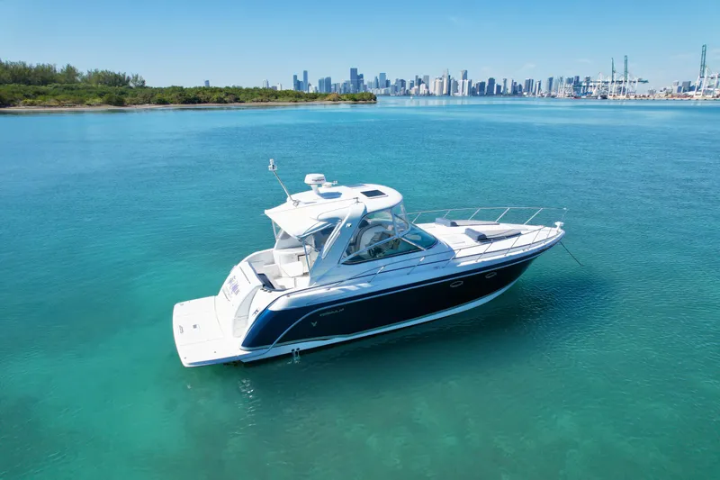40 Formula Pc Yacht Photos Pics 2006 Formula 40 PC yacht on clear blue water with city skyline in background.