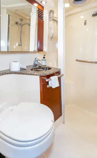 One Love Yacht Photos Pics Luxurious bathroom in 2006 Sea Ray 44 Sedan Bridge yacht with modern fixtures.