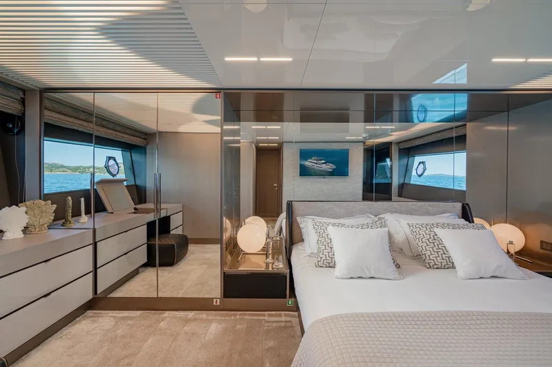  Yacht Photos Pics Luxurious bedroom interior of 2018 Ferretti Yachts 850, featuring elegant decor and ocean views.