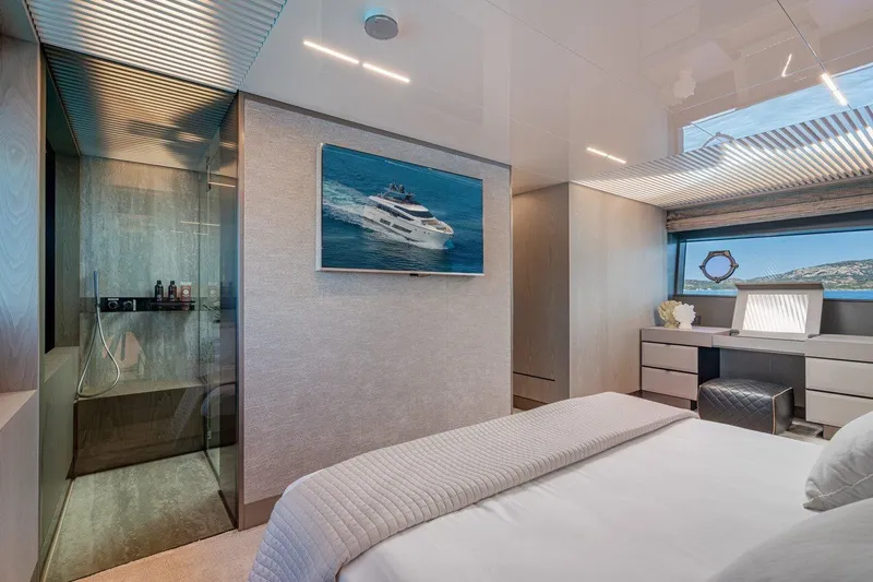  Yacht Photos Pics Luxurious bedroom interior on 2018 Ferretti Yachts 850 with modern decor and scenic window view.