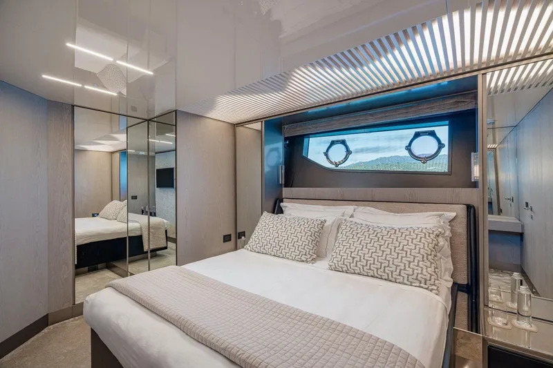  Yacht Photos Pics Luxurious bedroom interior of 2018 Ferretti Yachts 850, featuring elegant design and modern amenities.