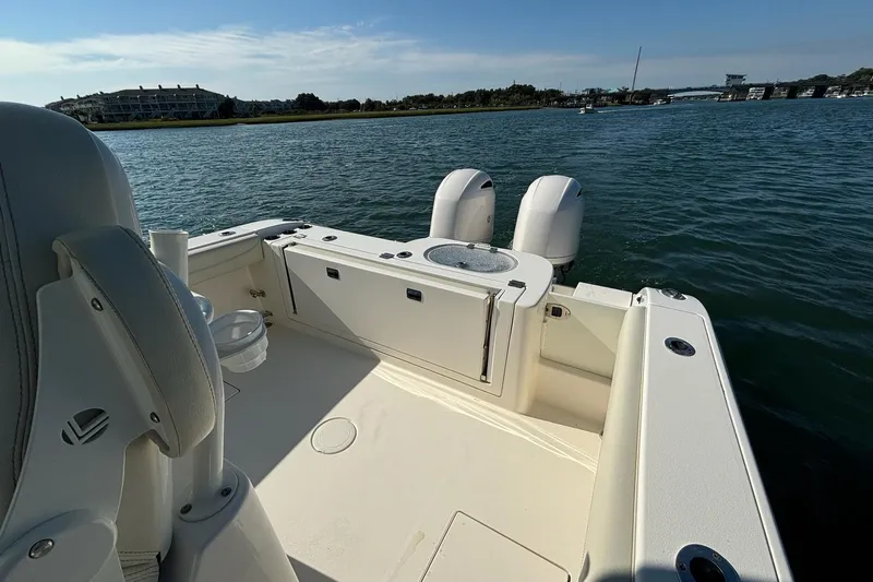  Yacht Photos Pics 2020 Cobia 280 Center Console boat on water, featuring dual engines and spacious deck.