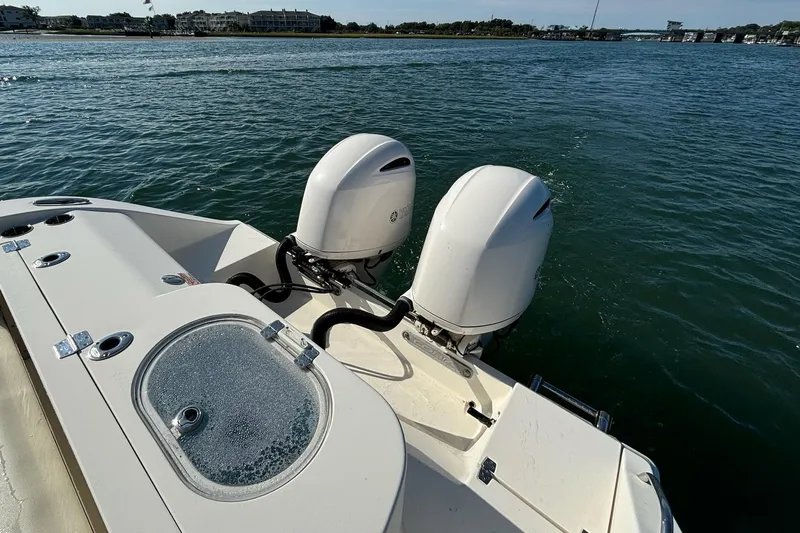  Yacht Photos Pics 2020 Cobia 280 Center Console boat with dual outboard motors on the water.