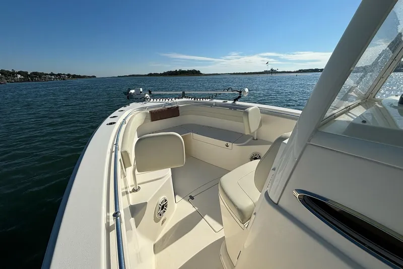  Yacht Photos Pics 2020 Cobia 280 Center Console boat on calm water, sunny day.