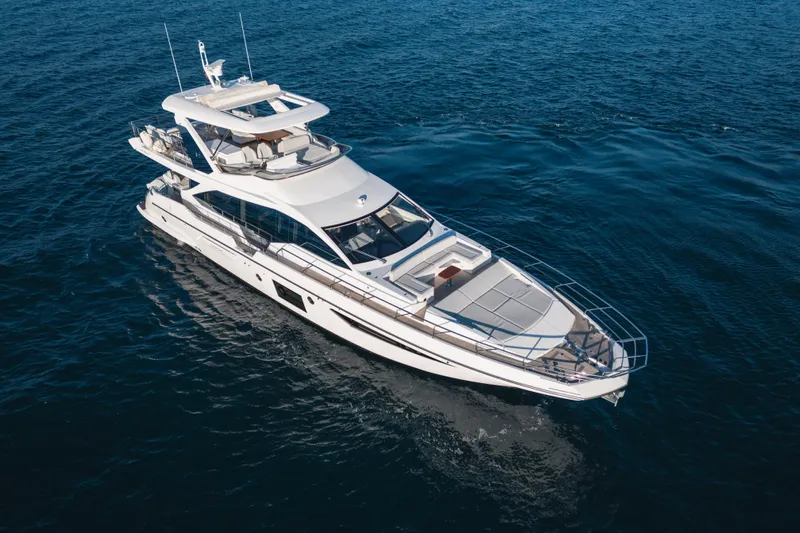  Yacht Photos Pics 2023 Azimut 72 Flybridge yacht cruising on open water.