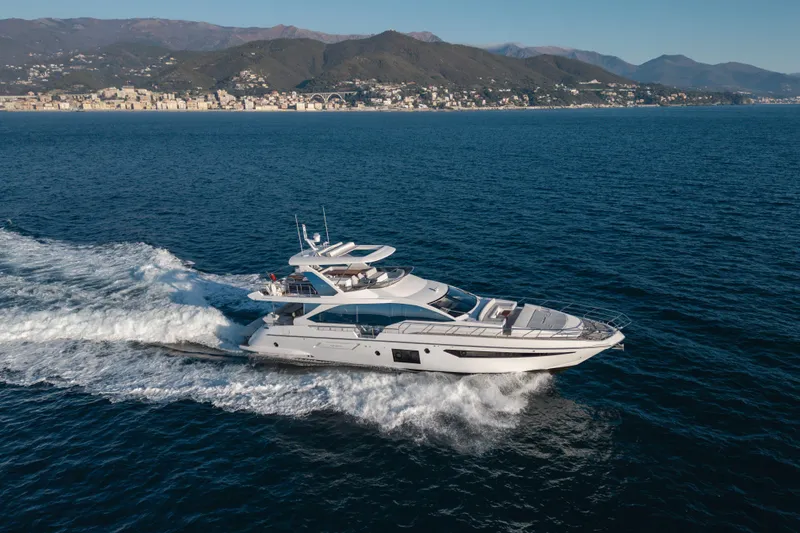  Yacht Photos Pics Azimut 72 Flybridge 2023 yacht cruising on open sea with scenic coastal backdrop.