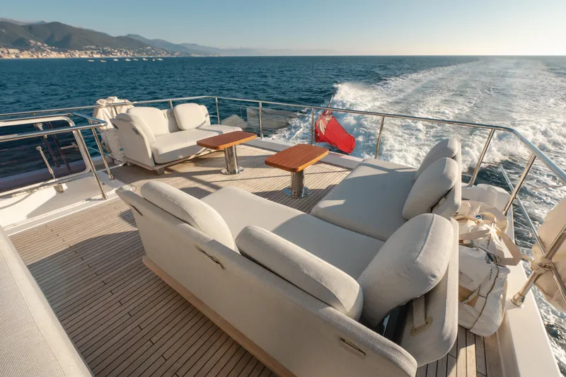  Yacht Photos Pics Luxurious 2023 Azimut 72 Flybridge yacht cruising with elegant deck seating and ocean view.