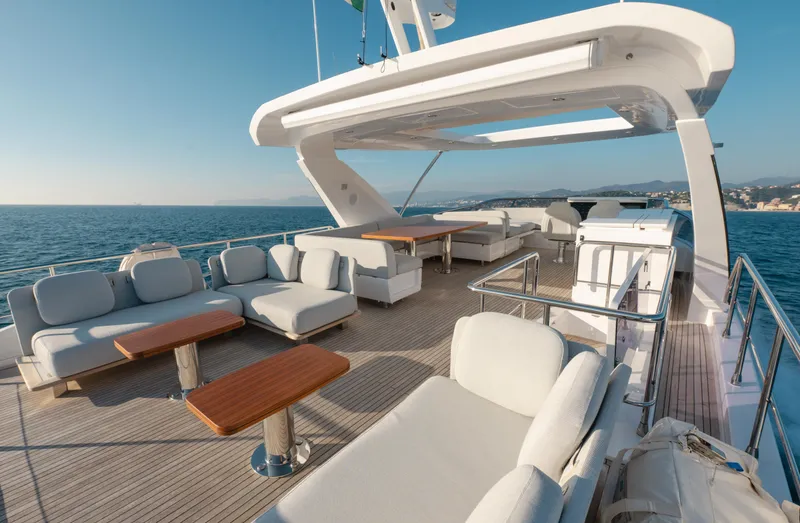  Yacht Photos Pics Luxurious 2023 Azimut 72 Flybridge yacht with spacious outdoor seating and ocean view.