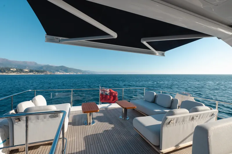  Yacht Photos Pics Luxurious 2023 Azimut 72 Flybridge yacht deck with ocean view and comfortable seating.
