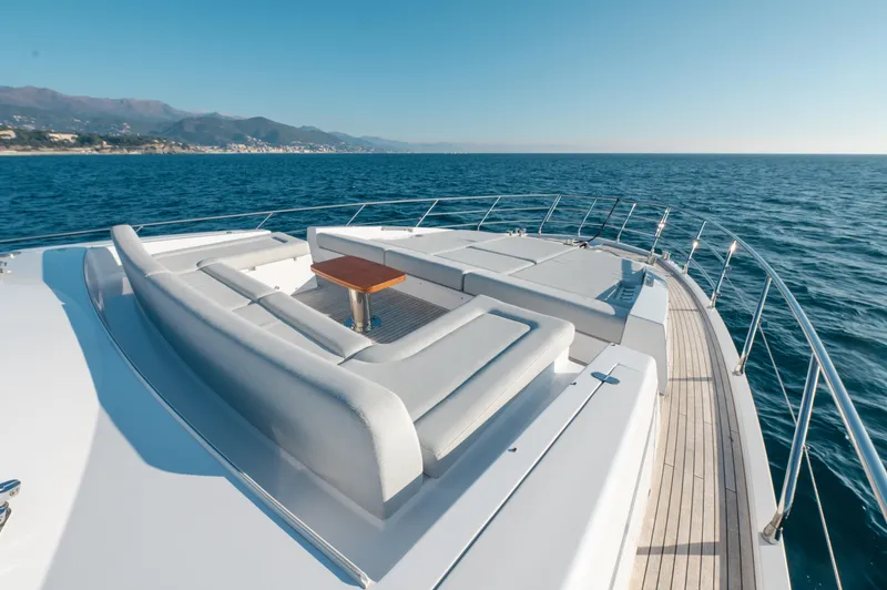  Yacht Photos Pics Luxurious 2023 Azimut 72 Flybridge yacht with spacious deck seating and ocean view.