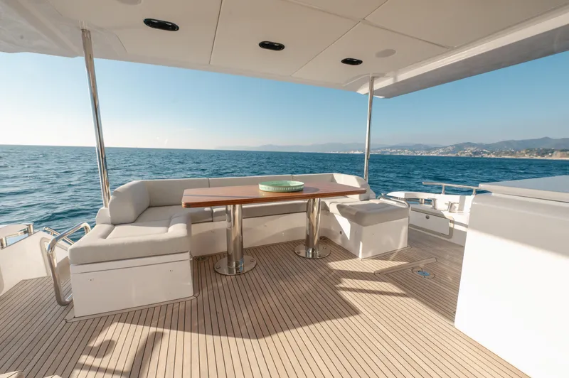  Yacht Photos Pics Luxurious Azimut 72 Flybridge 2023 yacht deck with elegant seating and ocean view.