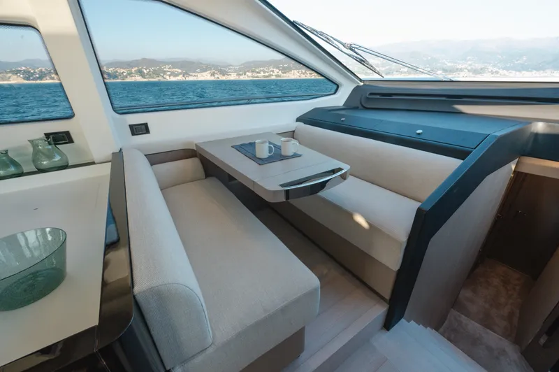  Yacht Photos Pics Luxurious interior of 2023 Azimut 72 Flybridge yacht with elegant seating and ocean view.