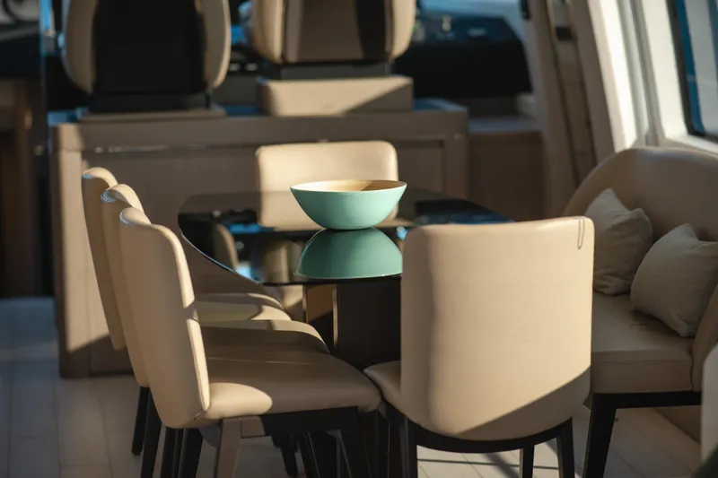  Yacht Photos Pics Luxurious interior of 2023 Azimut 72 Flybridge yacht with elegant dining area.