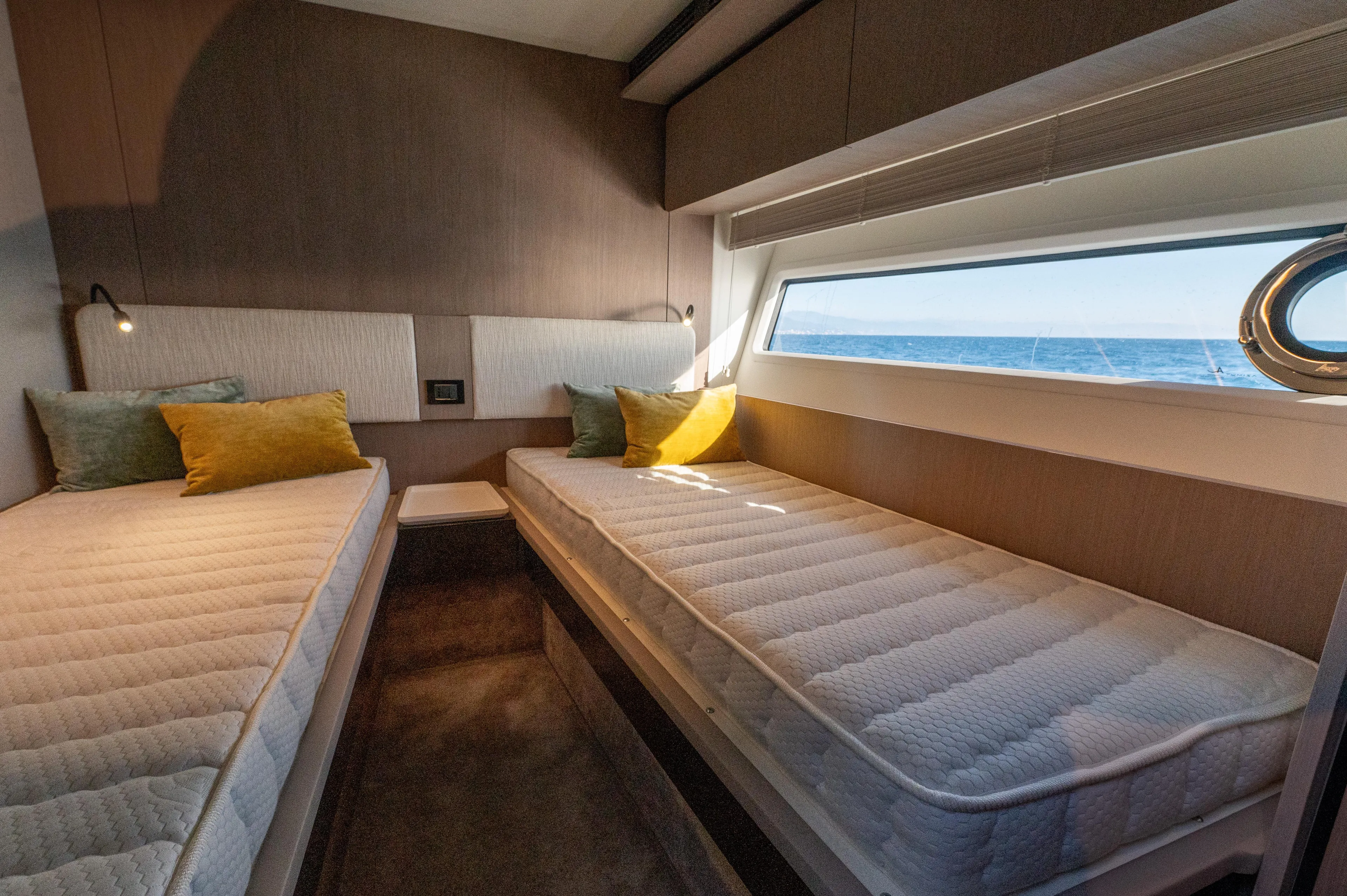  Yacht Photos Pics Luxurious cabin interior of 2023 Azimut 72 Flybridge yacht with twin beds and ocean view.