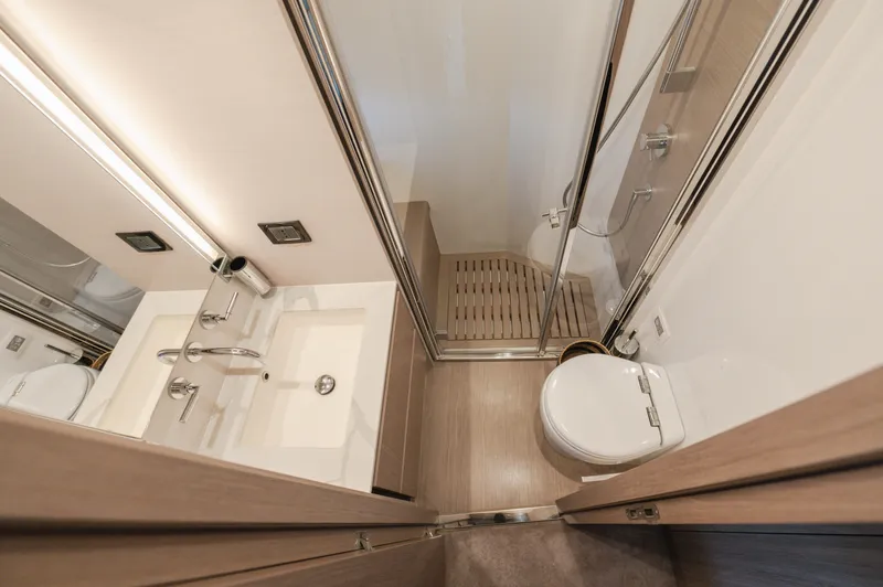  Yacht Photos Pics Luxurious bathroom in 2023 Azimut 72 Flybridge yacht with modern fixtures and shower.