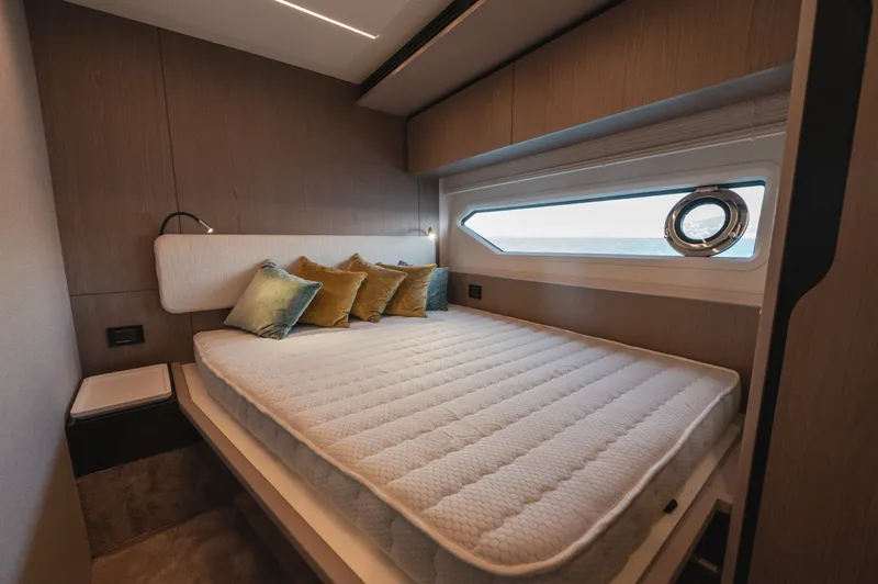  Yacht Photos Pics Luxurious bedroom interior of 2023 Azimut 72 Flybridge yacht with modern design and ocean view.