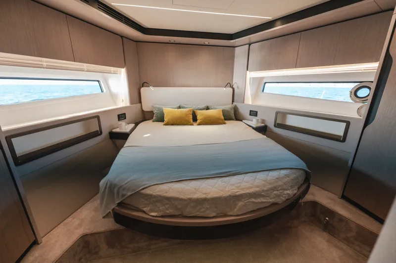  Yacht Photos Pics Luxurious bedroom interior of 2023 Azimut 72 Flybridge yacht with modern design and ocean view.
