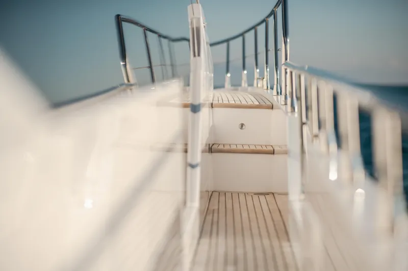  Yacht Photos Pics 2023 Azimut 72 Flybridge yacht deck with wooden steps and sleek railings.