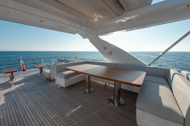  Yacht Photos Pics Luxurious 2023 Azimut 72 Flybridge yacht deck with elegant seating and ocean view.