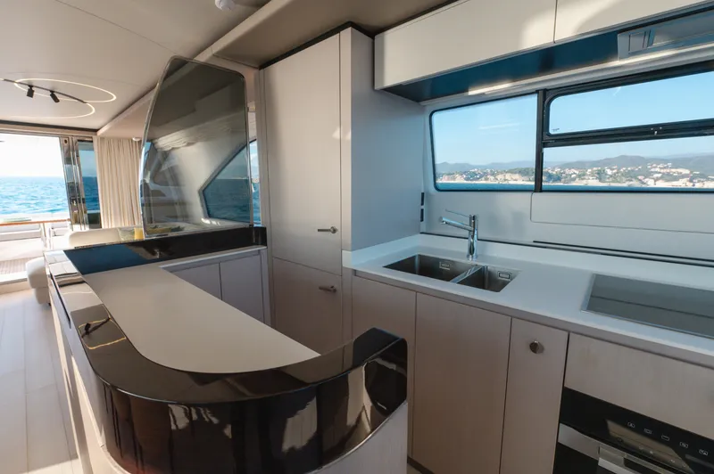  Yacht Photos Pics Luxurious kitchen interior of 2023 Azimut 72 Flybridge yacht with ocean view.