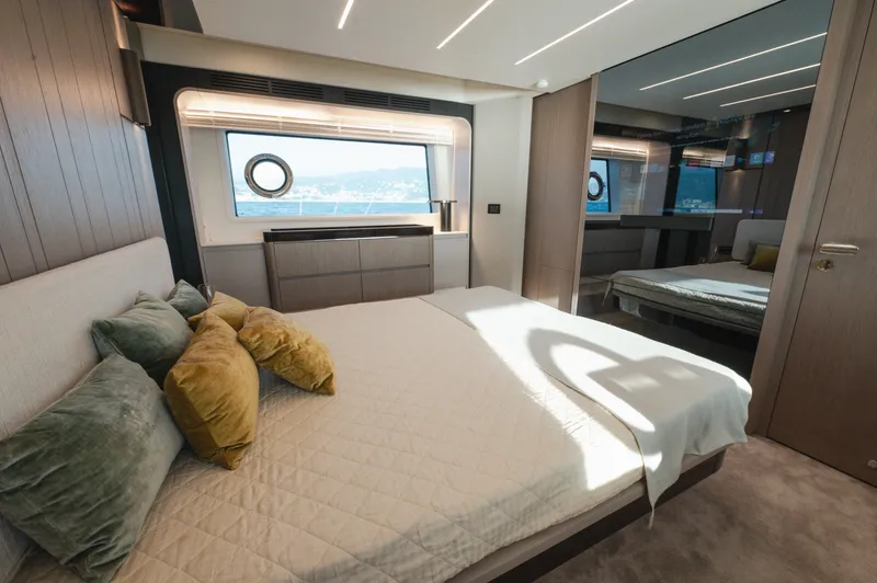  Yacht Photos Pics Luxurious bedroom interior of 2023 Azimut 72 Flybridge yacht with modern design and ocean view.