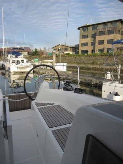  Yacht Photos Pics 2024 Jeanneau Sun Odyssey 410 docked, showcasing sleek design and modern features.